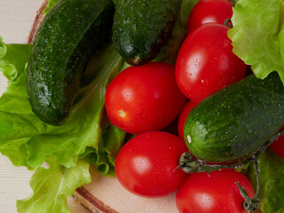 Full bowl of low calories salad with tomato, pepper, cucumber lies on scratched dark concrete. Vegetarian, dieting, healthy food. Close-up