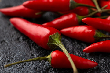 Fresh Red Bird's Eye Chili on rustic dark table