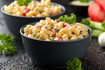 Macaroni Salad with red bell pepper, onion, celery, gherkins and mayonnaise dressing