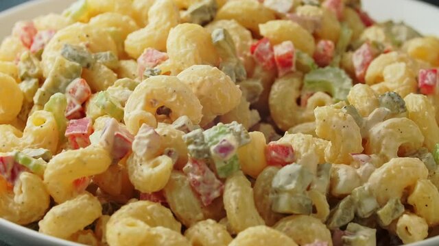 Macaroni Salad with red bell pepper, onion, celery, gherkins and mayonnaise dressing