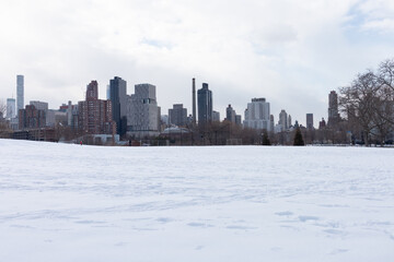 Rainey Park Field in Astoria Queens Covered in Snow during Winter with the New York City Skyline