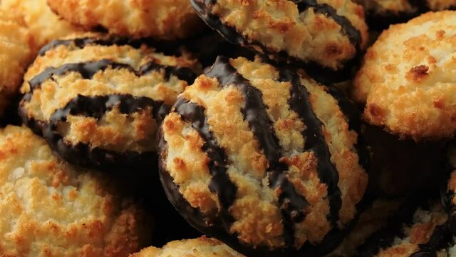Coconut macaroons cookies with drizzle of chocolate. Gluten free. rotating video