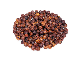 pile of dried red Kampot pepper closeup on white