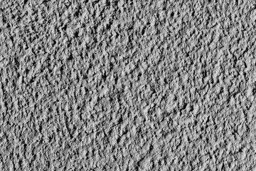 Rough yellow wall. Close up view, side lighting