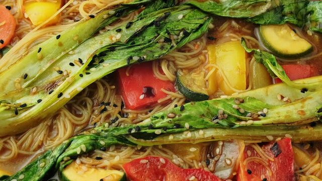 Asian style Pak choi, lemongrass, and ginger curried noodles. rotating video
