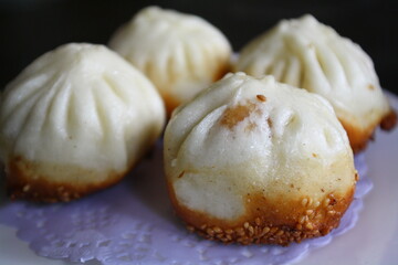 Dim sum served in a Chinese tea house. Char siu bao, a barbecue-pork-filled bun, served during yum cha.