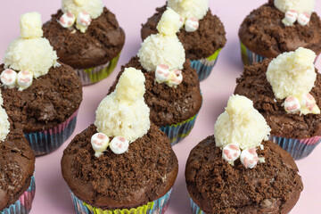 chocolate cupcake with bunny burrowing into soil
