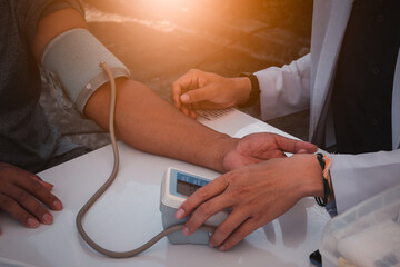 Closup of doctor hand, measure the blood pressure