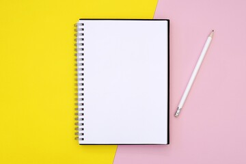 Empty spiral notebook mockup for design, planner, lettering, note, message, art presentation, journal mock up, bright yellow and pink background.