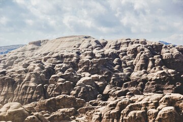 The huge rocky mountains of Al Beidha, called little Petra, with a cloudy sky