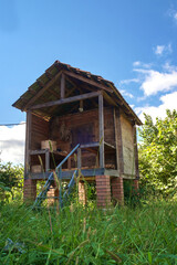 An old wooden storage hut in the field at countryside