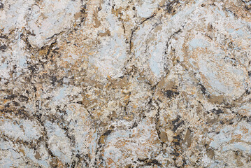 Abstract colored pattern on the wall in an avant-garde style in beige blue tones with black veins.