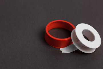 Plumbing tape in a roll for repair. Product packaging for pipe repair, leaks and flood sealing.