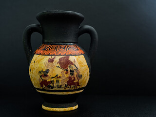 Ancient Greek vase isolated on black background. Traditional amphorae.