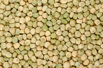 Snow pea seeds, background, from above. Also Chinese pea or pois mangetout, an edible-pod pea with flat pods and thin pod walls. Dried fruits of Pisum sativum used for sprouting. Backdrop. Food photo.