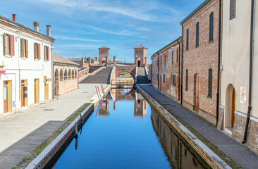Naklejka premium Comacchio, Italy - often compared to Venice for the canals and the architecture, Comacchio displays one of the most characteristic old towns in Emilia Romagna
