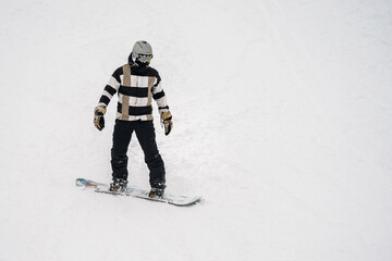 Fototapeta na wymiar Unidentified tourist does snowboard skiing in Flachau, ski resort in Austria