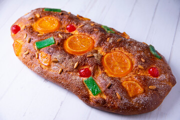 Coca de sant joan. Traditional San Juan cake to celebrate the arrival of summer in Spain made with brioche bread, candied fruit and nuts.