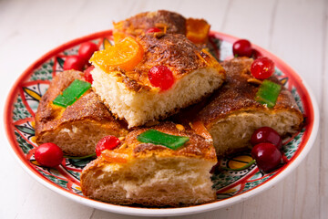 Coca de sant joan. Traditional San Juan cake to celebrate the arrival of summer in Spain made with brioche bread, candied fruit and nuts.