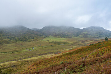 Fototapeta premium Beautiful autumn place with foggy sky near Loch ness.