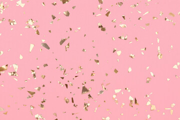 Golden confetti on pastel pink background, party gold glitter backdrop.