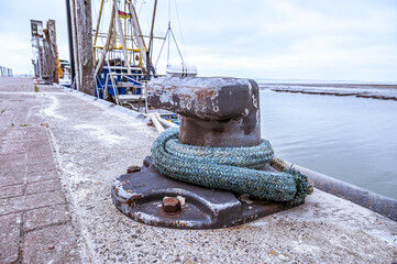 Thick rope in the harbor to secure a ship