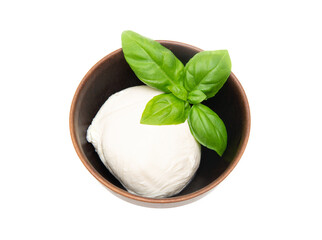 A ball of mozzarella cheese and basil leaves in a wooden bowl isolated on white