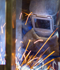 a welder in a mask © Marek