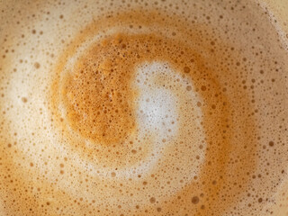 Cappuccino milk foam spiral closeup © scubaluna