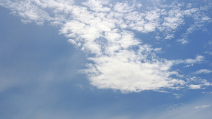 Fototapeta na wymiar Clouds on bright blue sky background