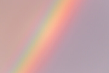 Part of the rainbow going from top to bottom on the left side of the photo against the dark overcast sky. Colorful weather phenomenon. High quality photo