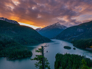 Sunset in the mountains. Beautiful Diablo Lake is a reservoir in the North Cascade mountains of northern Washington state, United States.