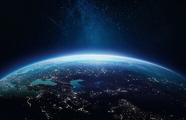 Planet Earth at night in the outer space. Earth surface. Abstract wallpaper with space and stars. City lights on planet. Elements of this image furnished by NASA
