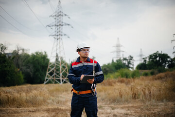 An energy worker inspects power lines. Energy