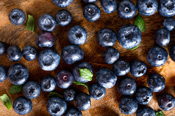 Blueberries on wooden background close up