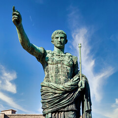 The roman emperor Gaius Julius Caesar statue in Rome, Italy. Concept for authority, domination,...