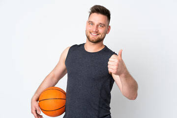 Russian handsome man isolated on white background playing basketball and with thumb up