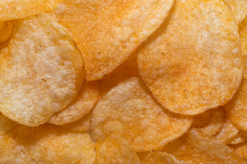Chips. Background of chips in close-up. Chips are a harmful product. Chips. Background of chips in close-up. Chips are a harmful product. Crisps