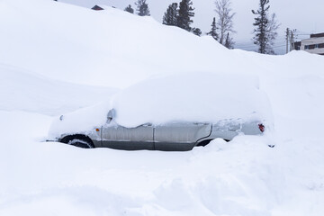 Blocked cars in parking lot after snow storm, winter frost