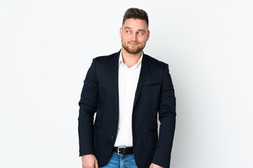 Young Russian business man isolated on white background standing and looking to the side