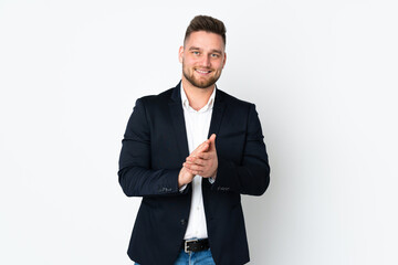 Young Russian business man isolated on white background applauding