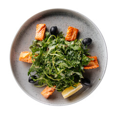 Isolated plate of roasted salmon and arugula salad on white background