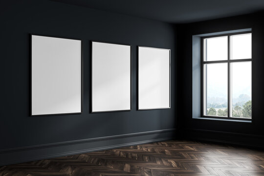 Dark blue empty living room with windows, parquet floor and mockup posters