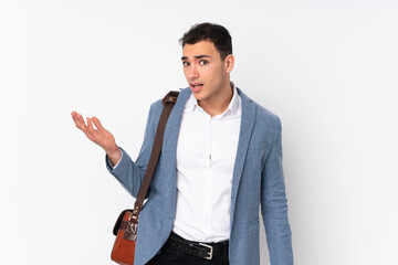 Young handsome businessman on isolated background making doubts gesture