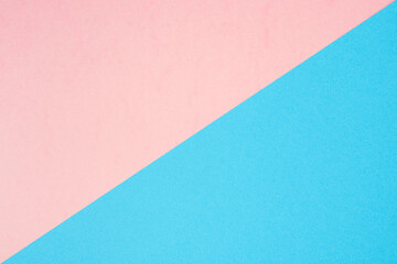 Background of two colors. Blue and pink paper sheets divided diagonally.