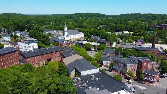 Amesbury historic downtown aerial view on Main Street including Market Square, Market Street Baptist Church and historic mill buildings in city of Amesbury, Massachusetts MA, USA.  