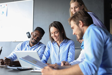 startup business team on meeting in modern bright office interior brainstorming, working on laptop and tablet computer