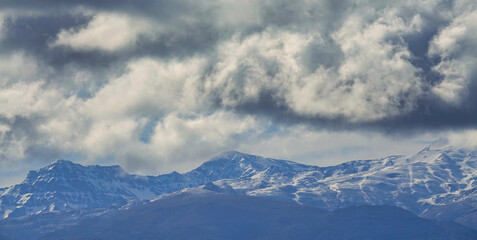 View of the snowy Sierra Nevada a cloudy day; Mulhacén is the highest peak in the Iberian Peninsula