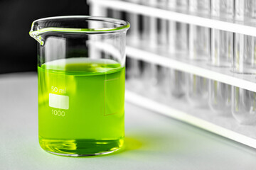 Test liquid chemical in glass beaker in laboratory