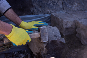 Close-up of construction process mason work with brick installation